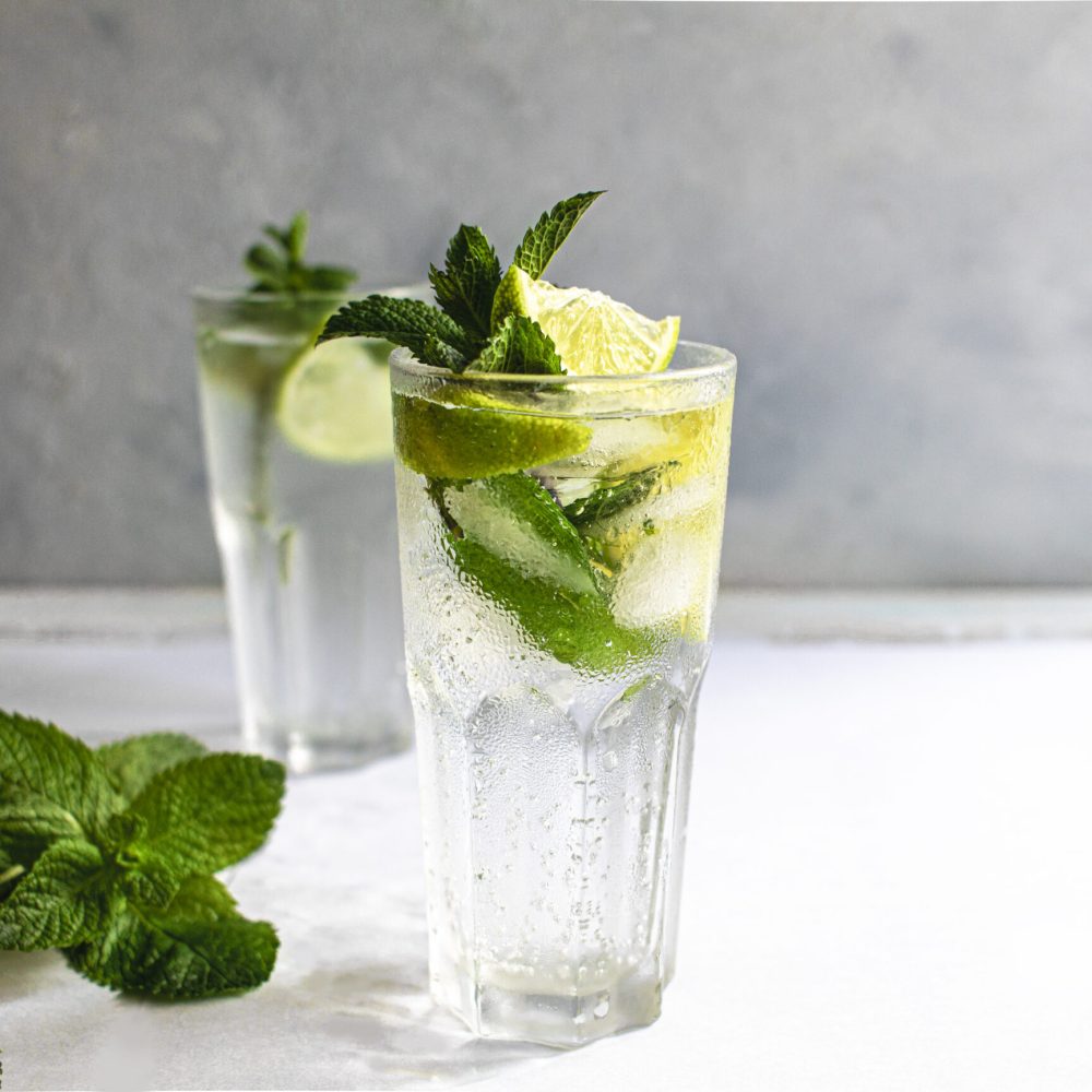 Mojito summer refreshing cocktail with ice, lime and mint. Copy space